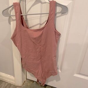 Woman’s pink bodysuit size medium from Abercrombie and Fitch